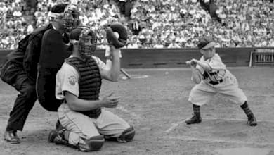 Eddie Gaedel, 3-foot-7, in his batting stance for the St. Louis Browns as Detroit catcher Bob Swift kneels, August 19, 1951.
