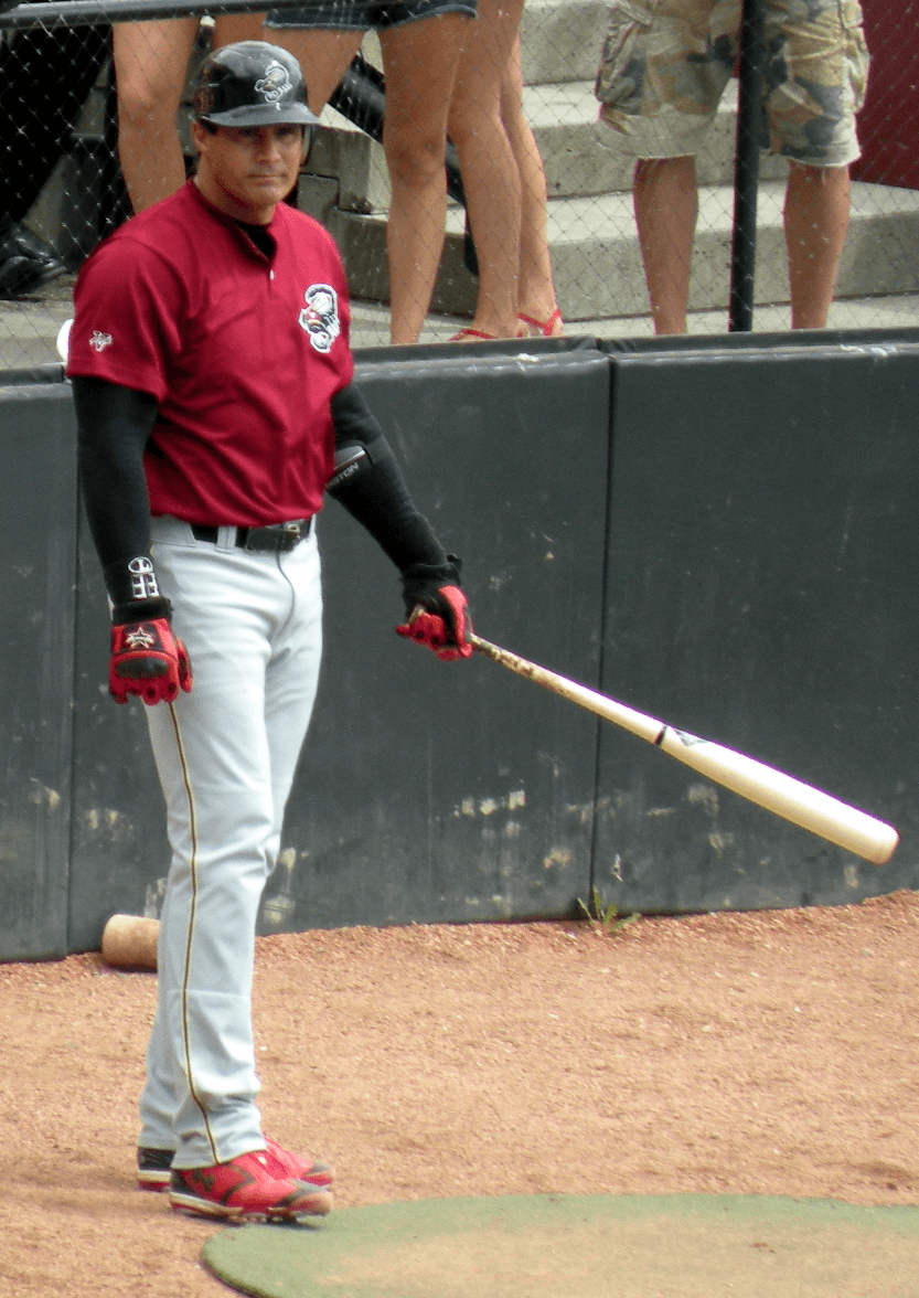 Jose Canseco with the Yuma Scorpions in 2011. He is not in a Rangers uniform, and this is not the fly ball at Cleveland Stadium.